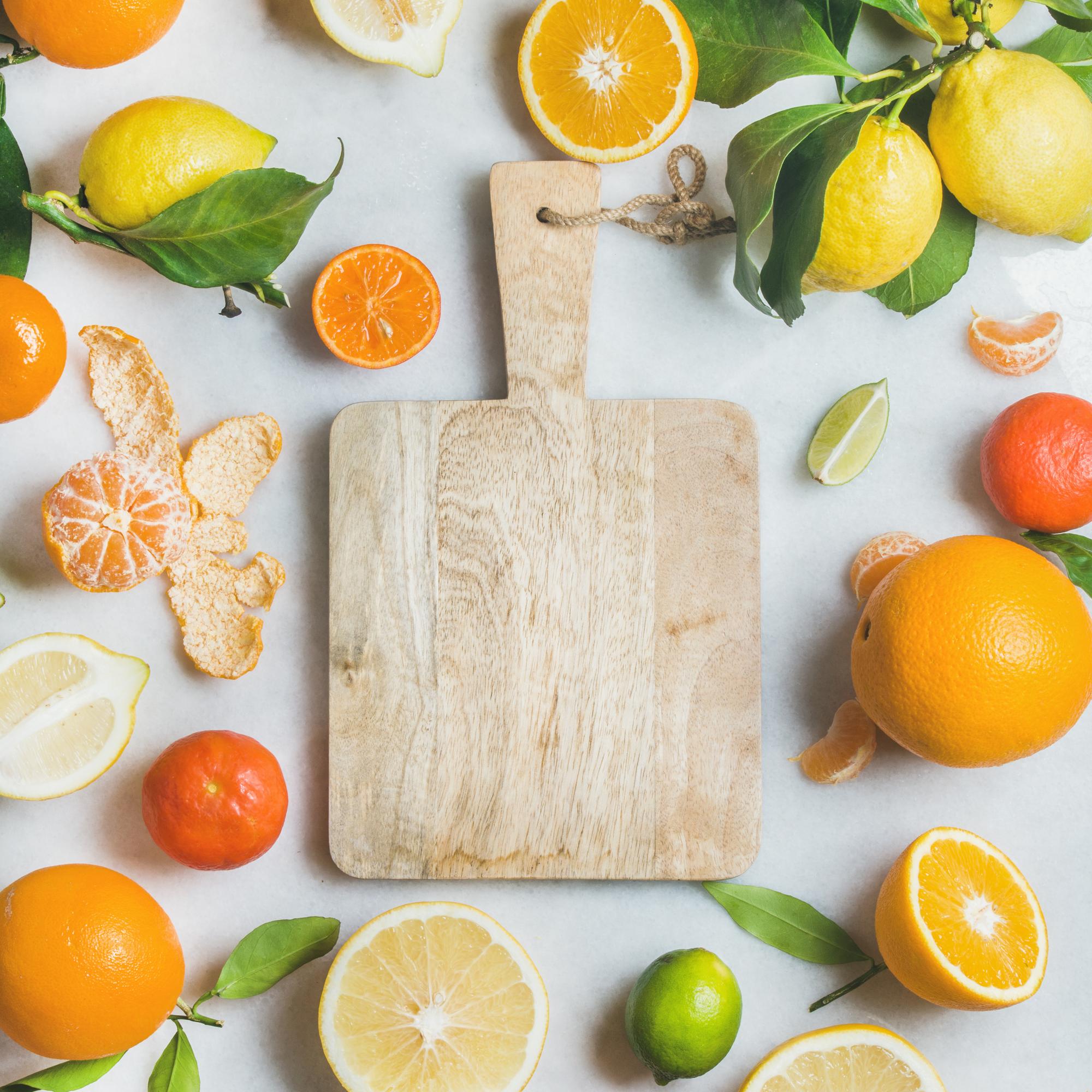 Close view of scented citrus and spices on a board